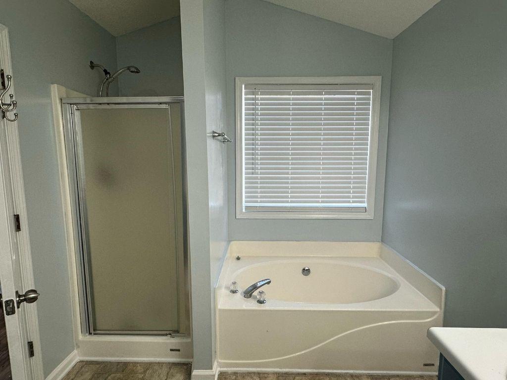 1261 Lakeview Road Grayson, GA 30017 - Photo 4 of 35 a bathroom with a bathtub and a shower