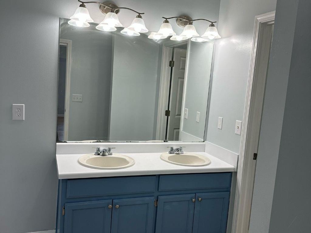 1261 Lakeview Road Grayson, GA 30017 - Photo 5 of 35 a bathroom with a sink and a mirror