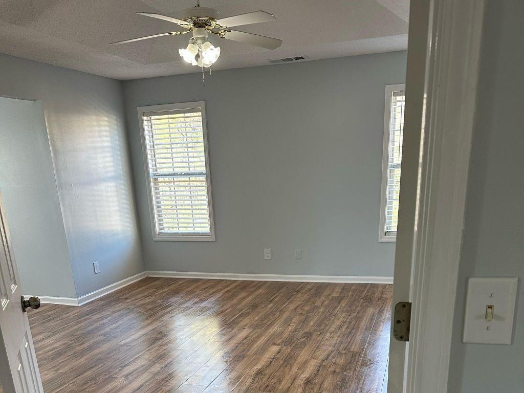 1261 Lakeview Road Grayson, GA 30017 - Photo 8 of 35 wooden floor in an empty room with a window