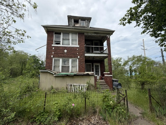 304 Polk Street Gary, IN 46402 - Photo 1 of 26 a view of a house with pool and garden