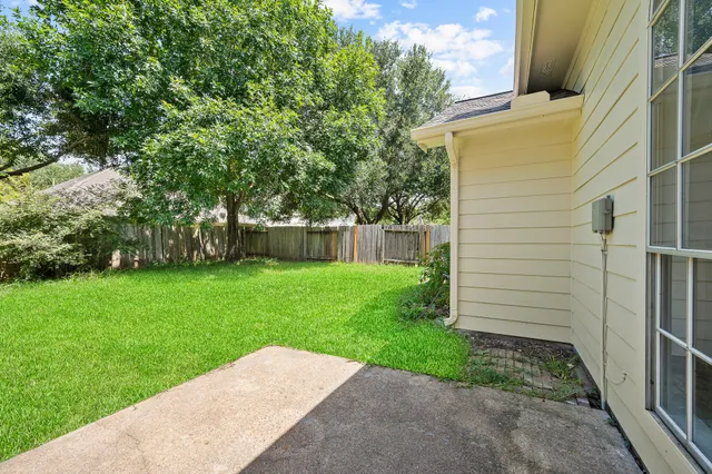 a backyard of a house with lots of green space