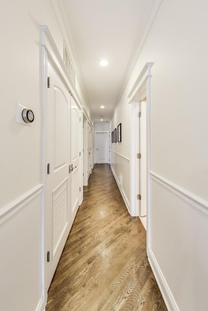 456 West Briar Place, Unit 2 Chicago, IL 60657 - Photo 12 of 25 a view of a hallway with white walls