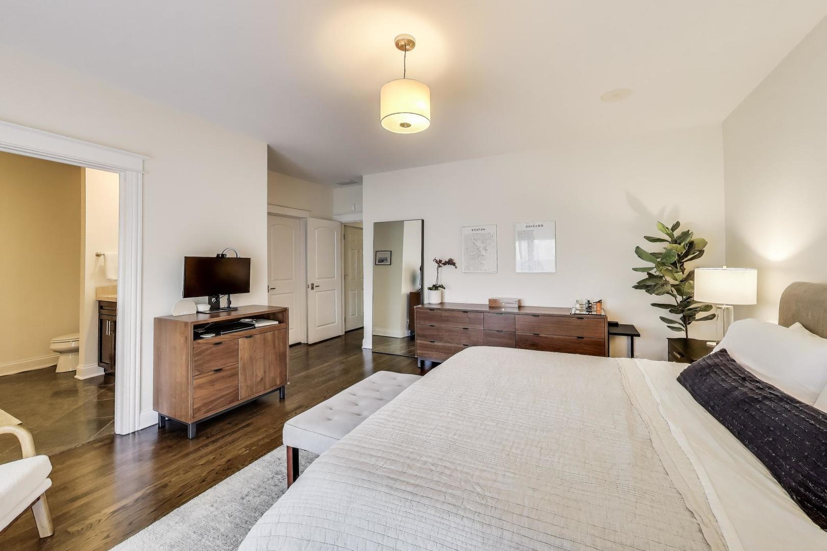 456 West Briar Place, Unit 2 Chicago, IL 60657 - Photo 15 of 25 a bedroom with a bed and a flat screen tv