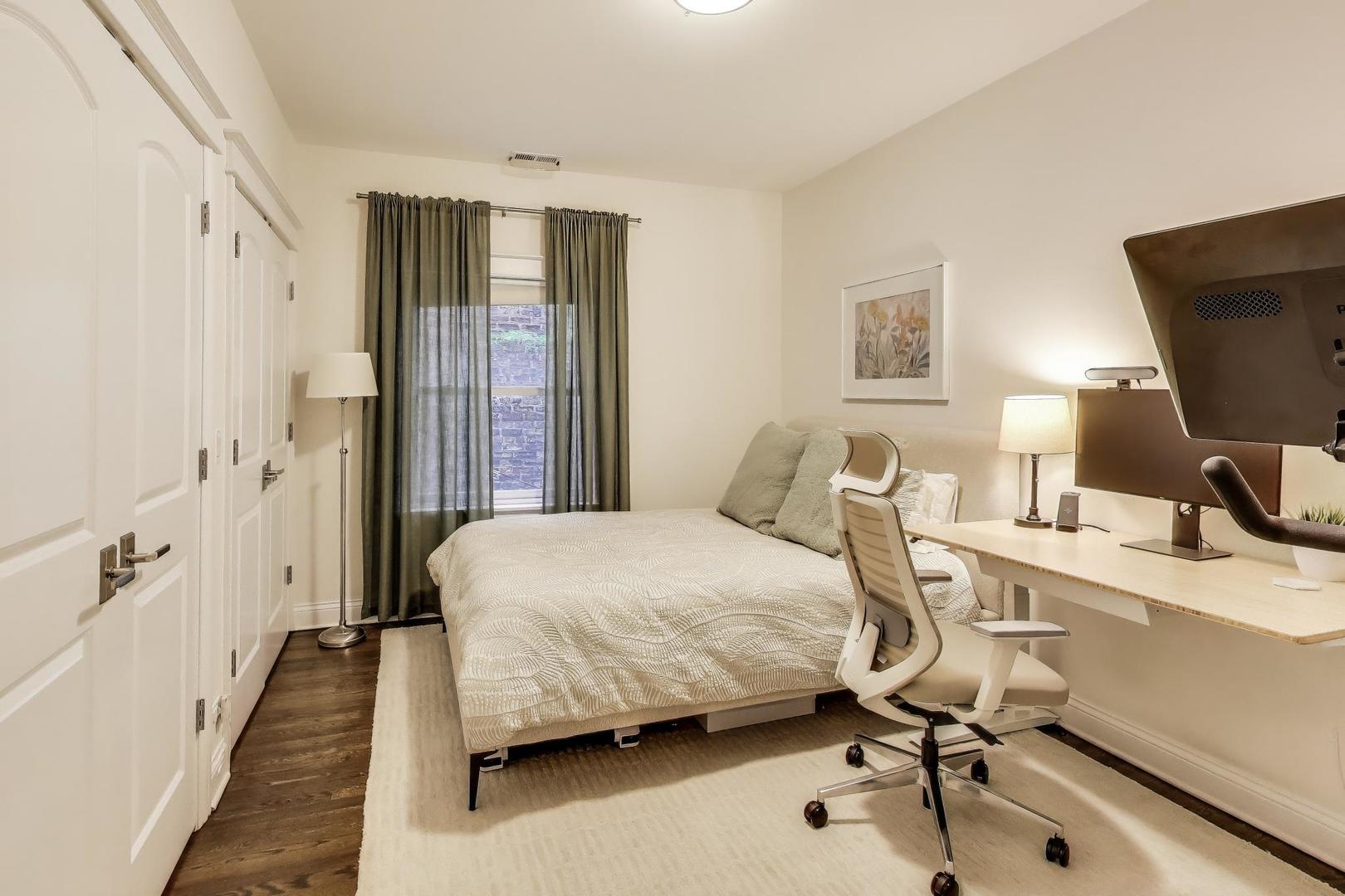456 West Briar Place, Unit 2 Chicago, IL 60657 - Photo 18 of 25 a bedroom with a bed and a desk