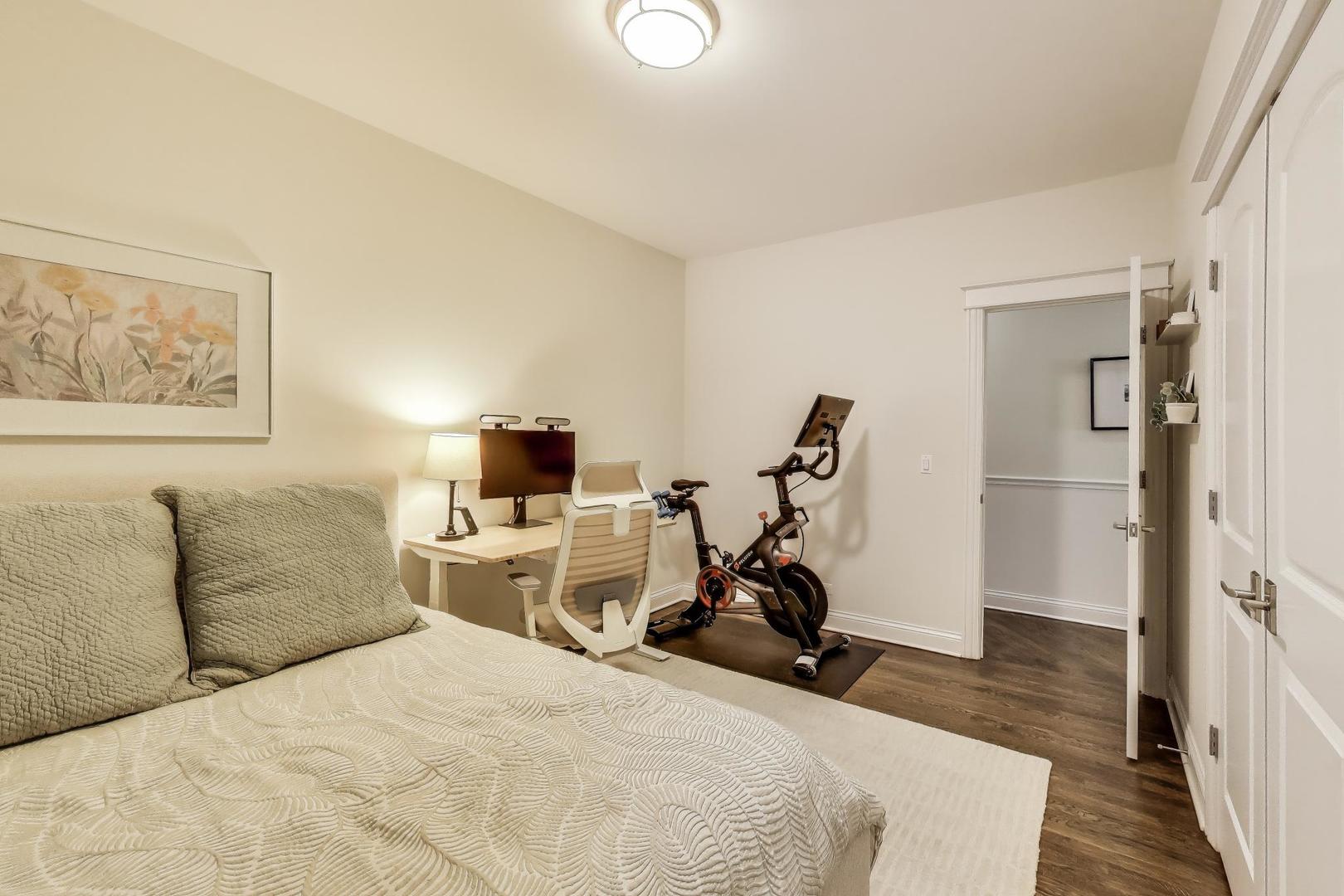 456 West Briar Place, Unit 2 Chicago, IL 60657 - Photo 19 of 25 a bed room with a bed and a chair