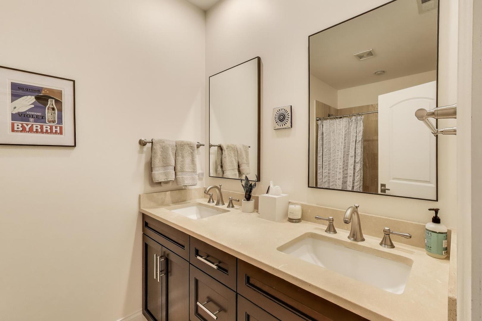 456 West Briar Place, Unit 2 Chicago, IL 60657 - Photo 22 of 25 a bathroom with a sink and a mirror