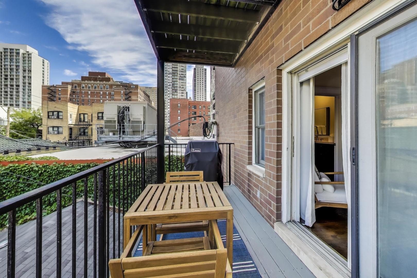 456 West Briar Place, Unit 2 Chicago, IL 60657 - Photo 23 of 25 a view of a balcony with wooden floor