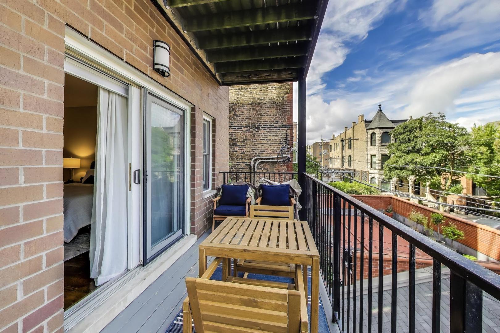 456 West Briar Place, Unit 2 Chicago, IL 60657 - Photo 24 of 25 a view of a balcony with wooden floor