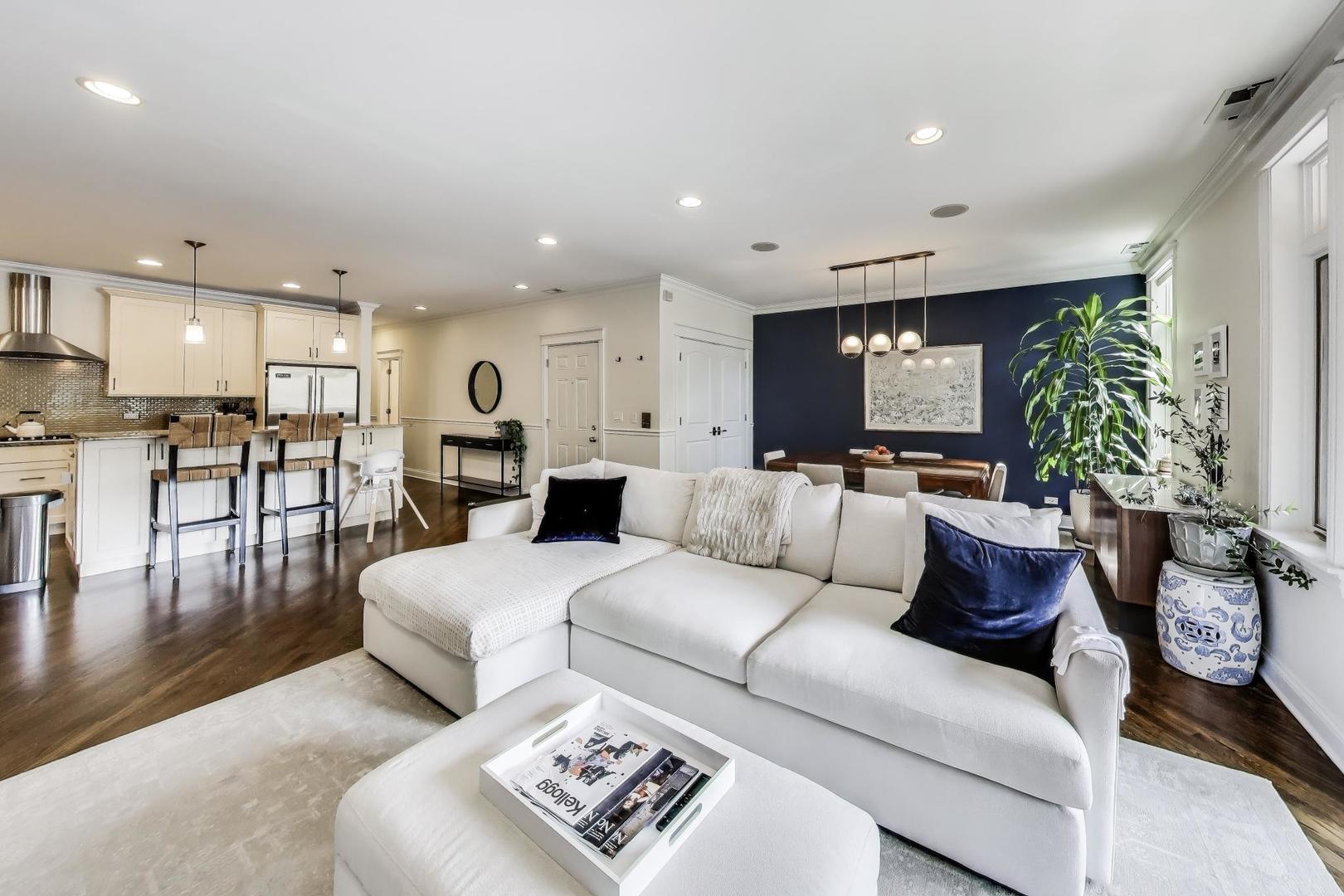 456 West Briar Place, Unit 2 Chicago, IL 60657 - Photo 3 of 25 a living room with furniture kitchen and a table