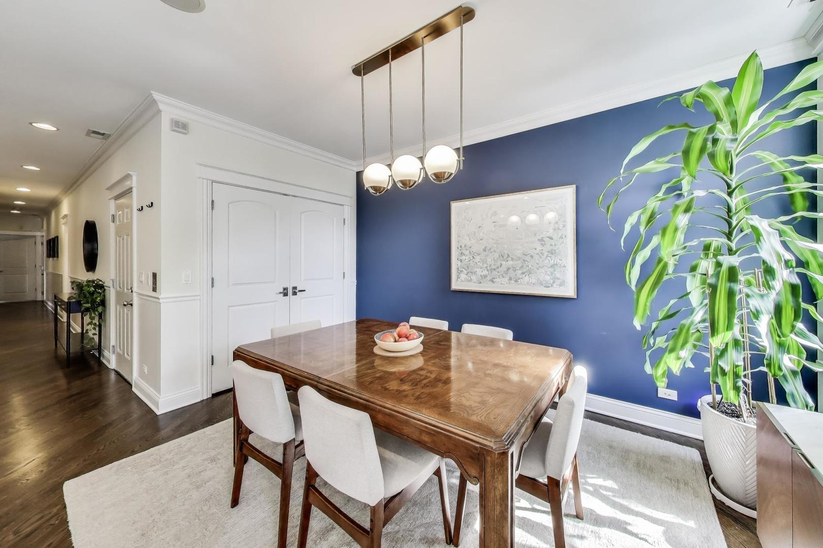 456 West Briar Place, Unit 2 Chicago, IL 60657 - Photo 8 of 25 a dining room with furniture and wooden floor