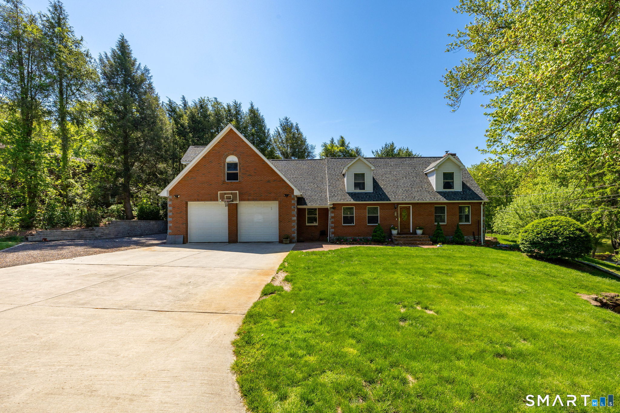 39 Chapman Road Marlborough, CT 06447 - Photo 2 of 40 a front view of a house with garden