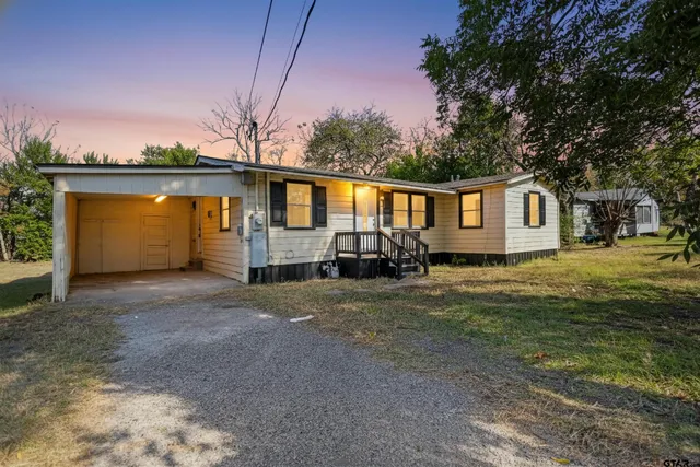 a house view with a backyard space