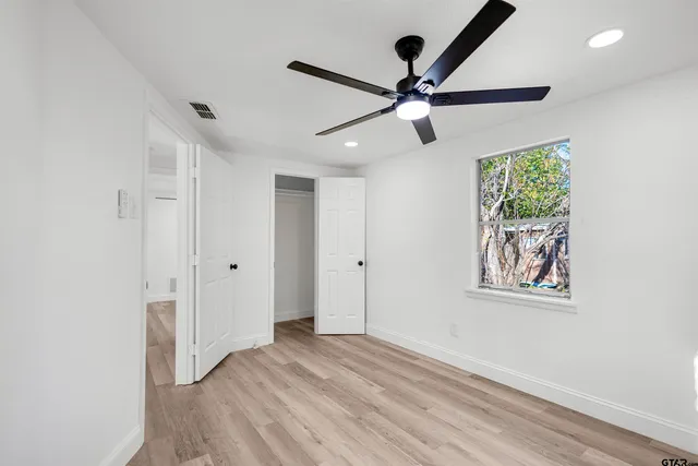 a view of an entryway with wooden floor