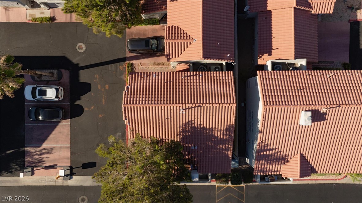 2246 Ramsgate Drive Henderson, NV 89074 - Photo 32 of 36 An aerial perspective showcases a vibrant community with distinct red tile roofs and ample parking.