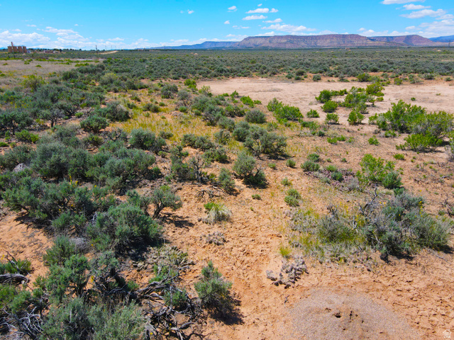 4500 South 22750th Duchesne, UT 84021 - Photo 30 of 34 Expansive undeveloped land featuring arid landscape, scattered native shrubs, and distant mesa formations under a clear sky