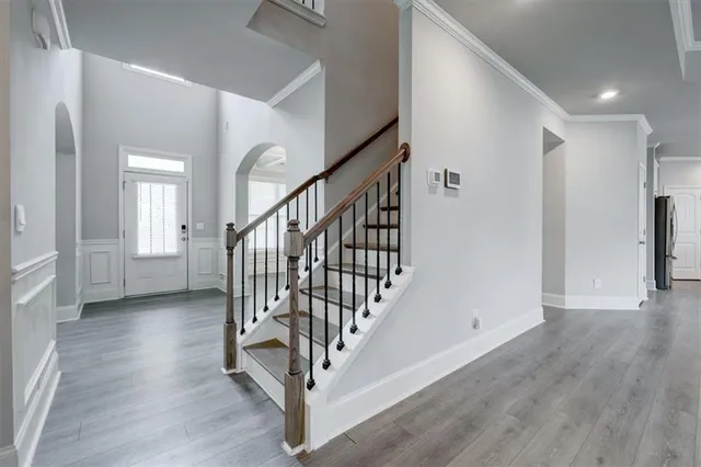 a view of an entryway with wooden floor