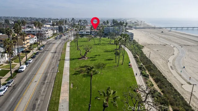 a green field with lots of trees in it