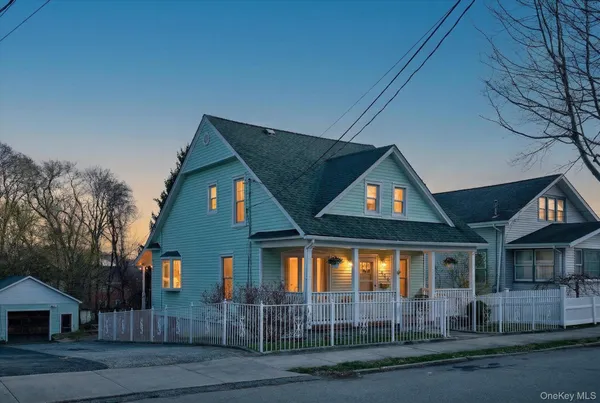 a house with tree in front of it