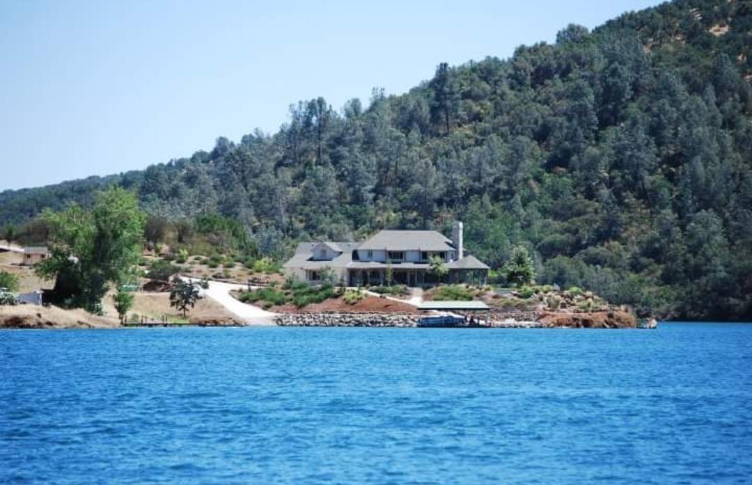 2307 Arrowhead Street Copperopolis, CA 95228 - Photo 11 of 18 a front view of a house with a yard and trees