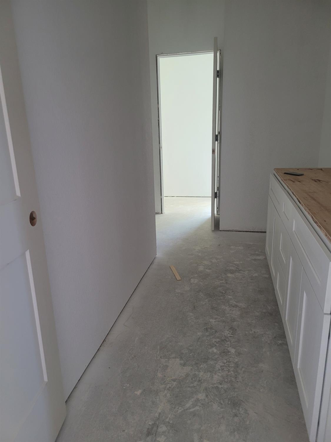 2307 Arrowhead Street Copperopolis, CA 95228 - Photo 18 of 32 a view of a hallway to rooms