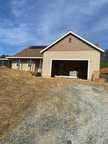 a view of a backyard of a house