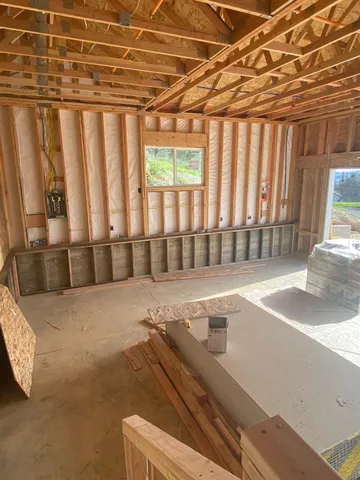 a view of a porch with wooden floor and fence