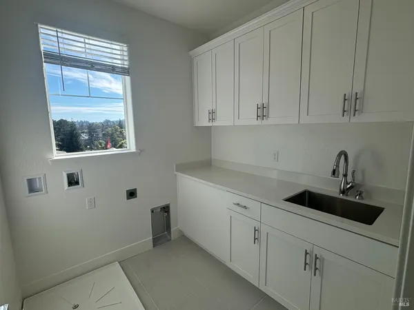a kitchen with a sink and cabinets