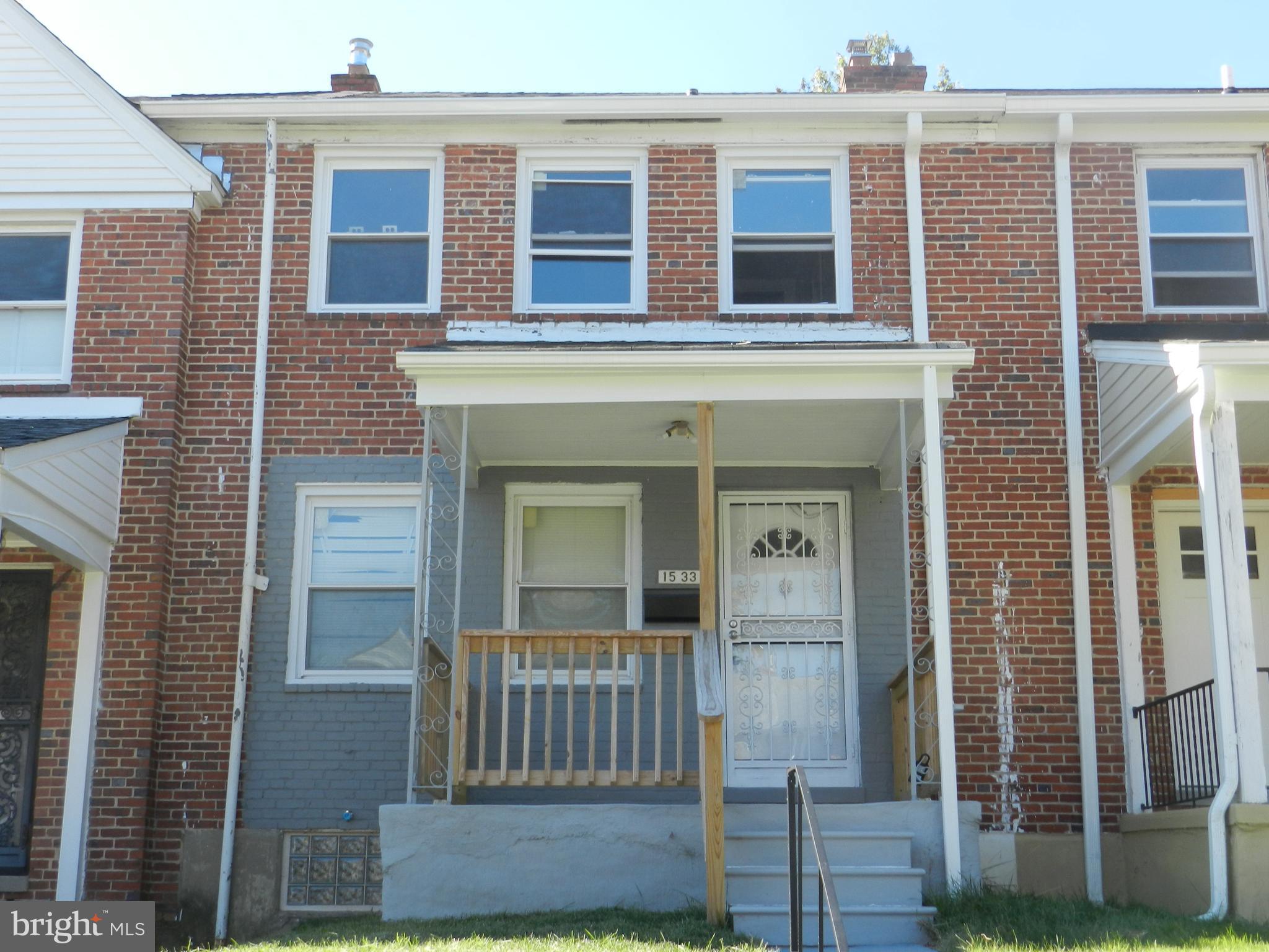 1533 Gleneagle Road Baltimore, MD 21239 - Photo 1 of 32 a front view of a house with a door