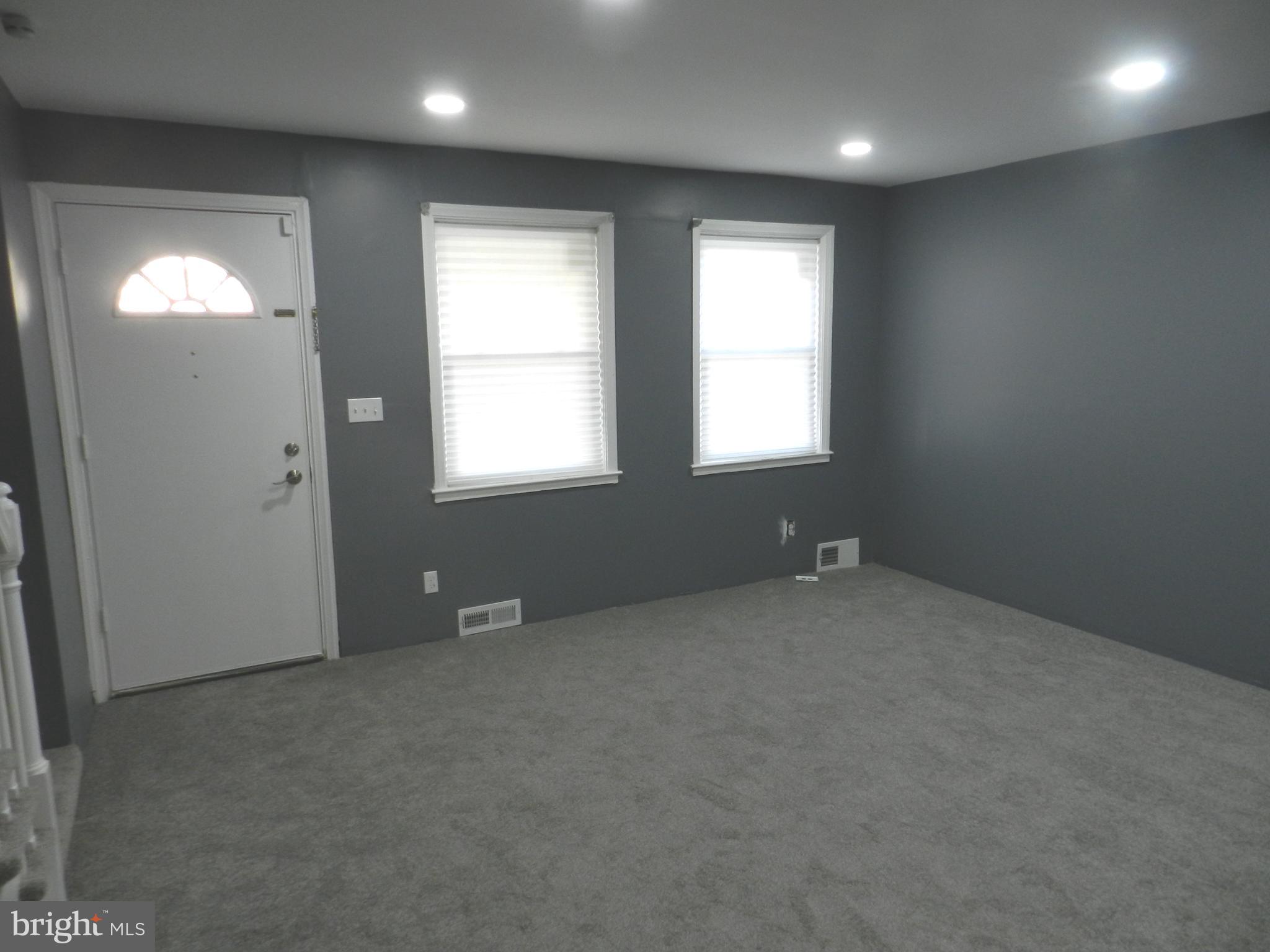 1533 Gleneagle Road Baltimore, MD 21239 - Photo 2 of 32 an empty room with windows