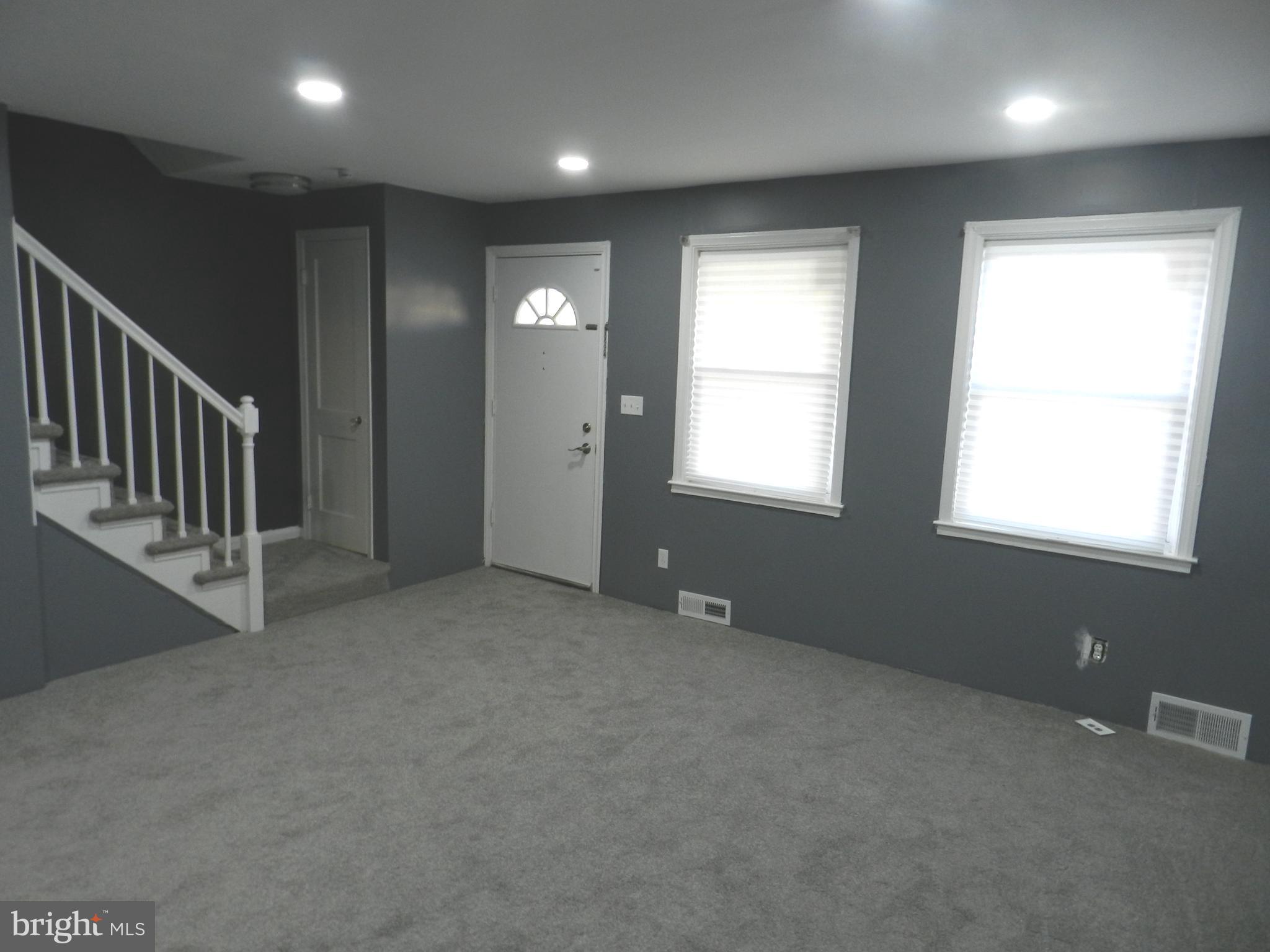 1533 Gleneagle Road Baltimore, MD 21239 - Photo 3 of 32 an empty room with windows