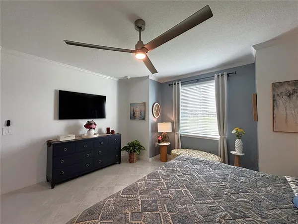 a bedroom with bed and window