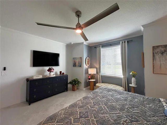 a bedroom with bed and window