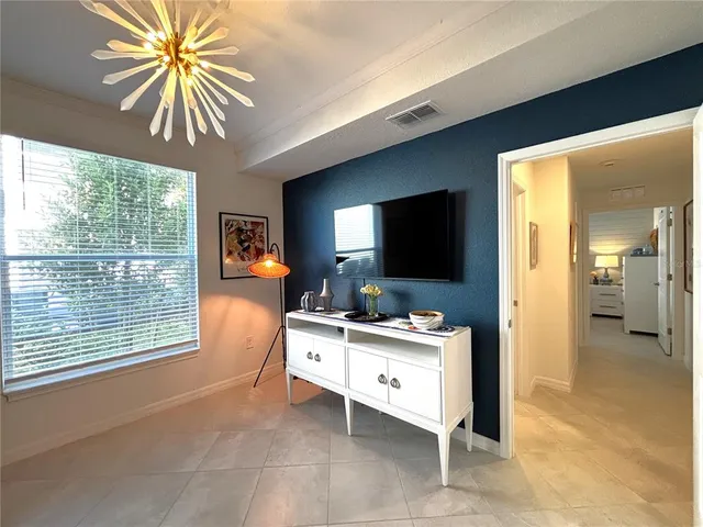 a view of a palm tree with a yard