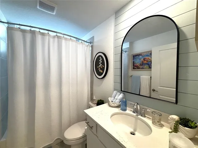 a front view of a house with a yard and street view