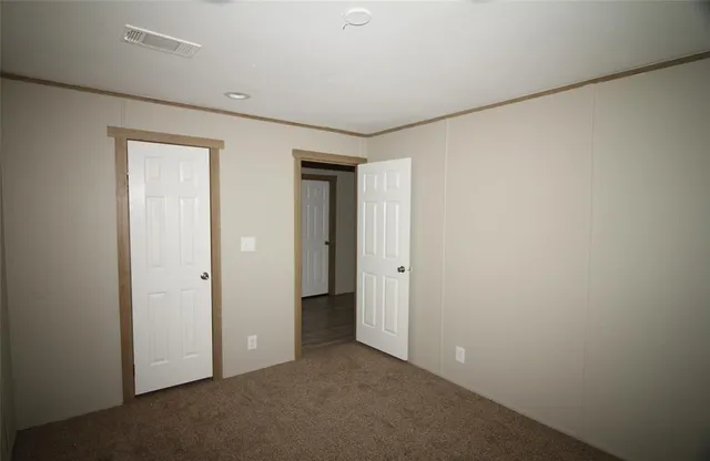 a view of hallway with closet