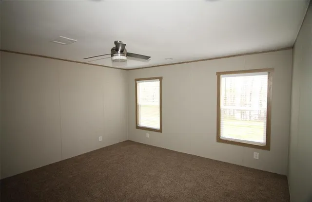 a view of empty room with windows