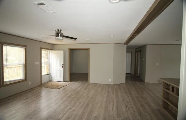 a view of livingroom with hardwood floor and a sink
