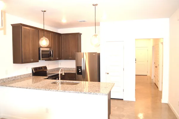 a bathroom with a sink a mirror and a light fixture