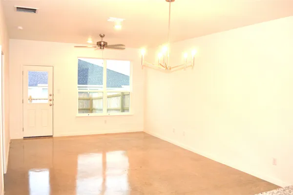 a view of a room that has a large window