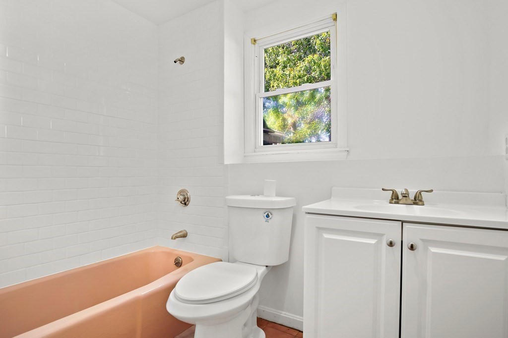 19 Murdoch Road Stoneham, MA 02180 - Photo 31 of 45 a bathroom with a sink a toilet and bathtub