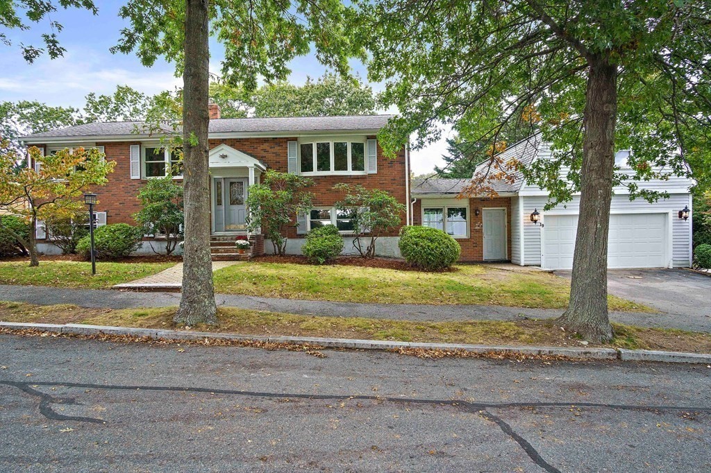 19 Murdoch Road Stoneham, MA 02180 - Photo 34 of 45 a front view of a house with a yard
