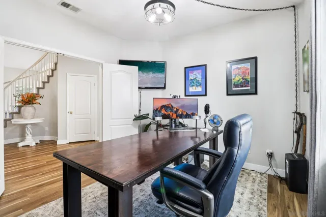 a white toilet sitting next to a bathroom sink
