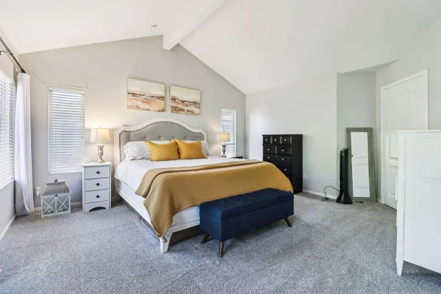 a bathroom with double sink and a mirror