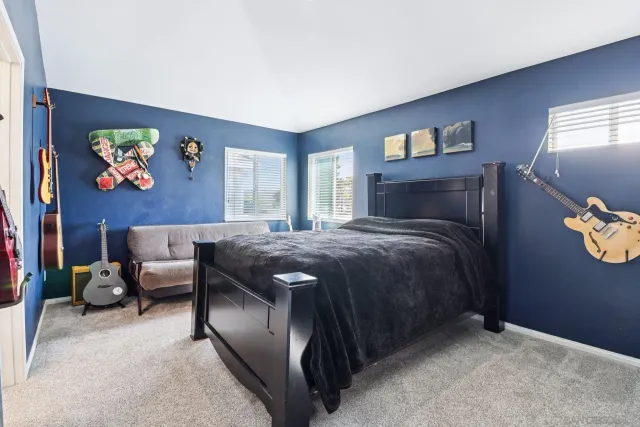 a view of walk in closet with clothes