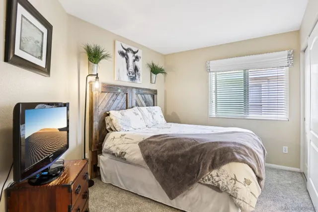 a view of a chairs and table in backyard of the house