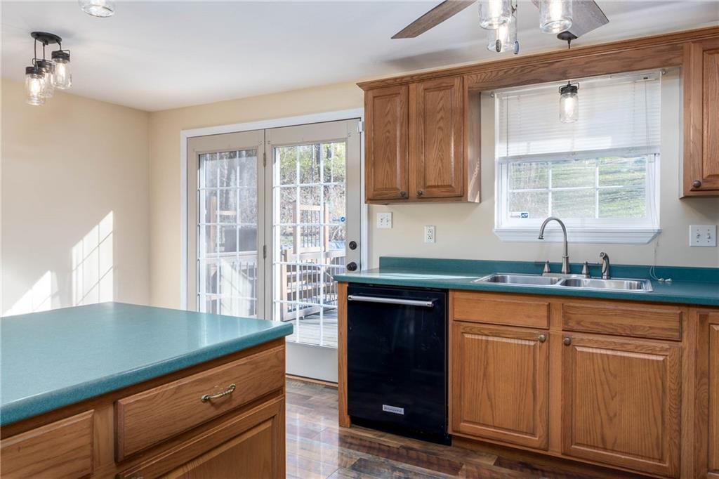166 Country Club Road Washington, PA 15301 - Photo 10 of 32 a kitchen with granite countertop a sink window and cabinets