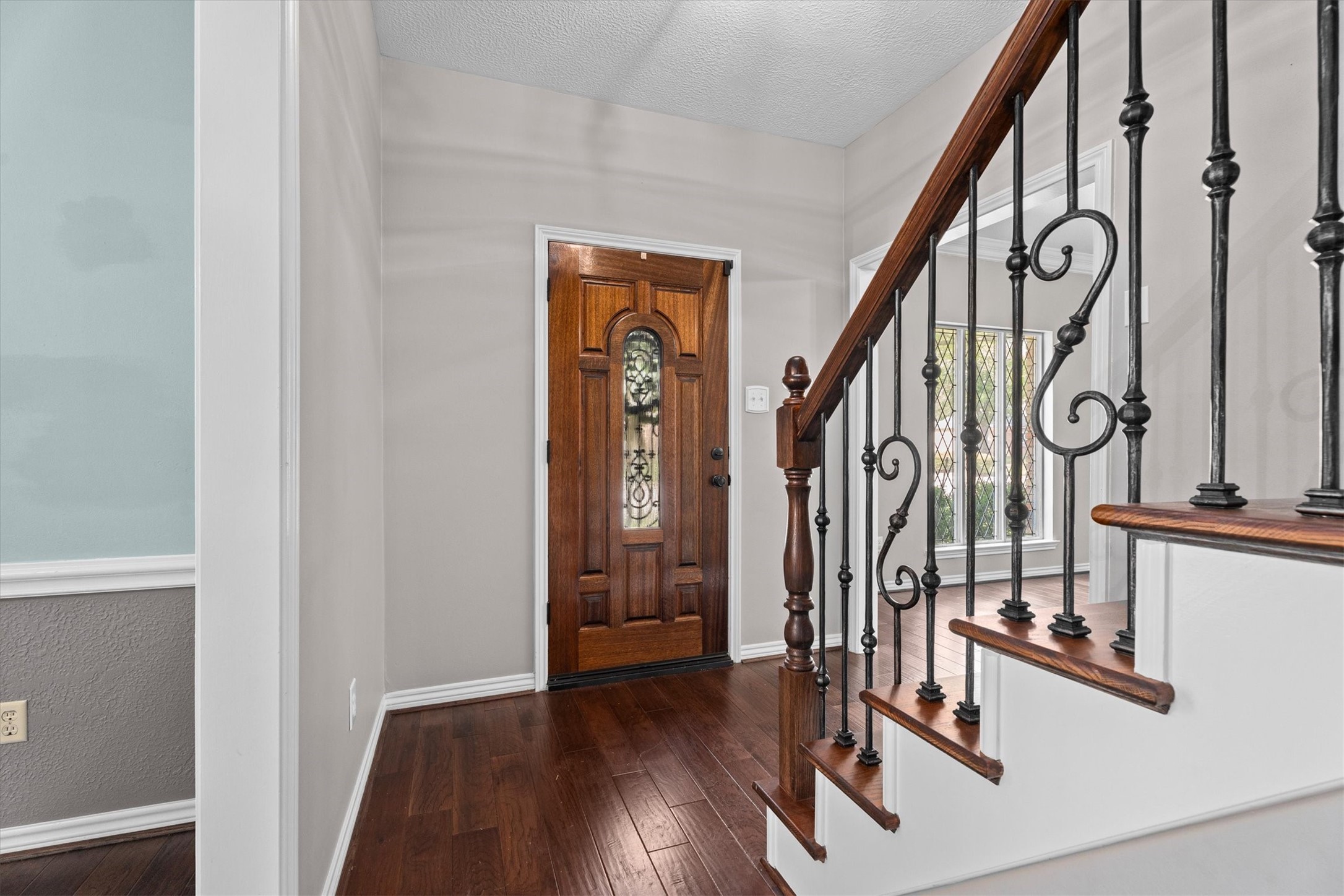 16267 Salmon Lane Spring, TX 77379 - Photo 5 of 48 Welcome in! Warm, wood flooring throughout the first floor welcomes you in and flows nicely into the formal living, dining, and family rooms from the entry.