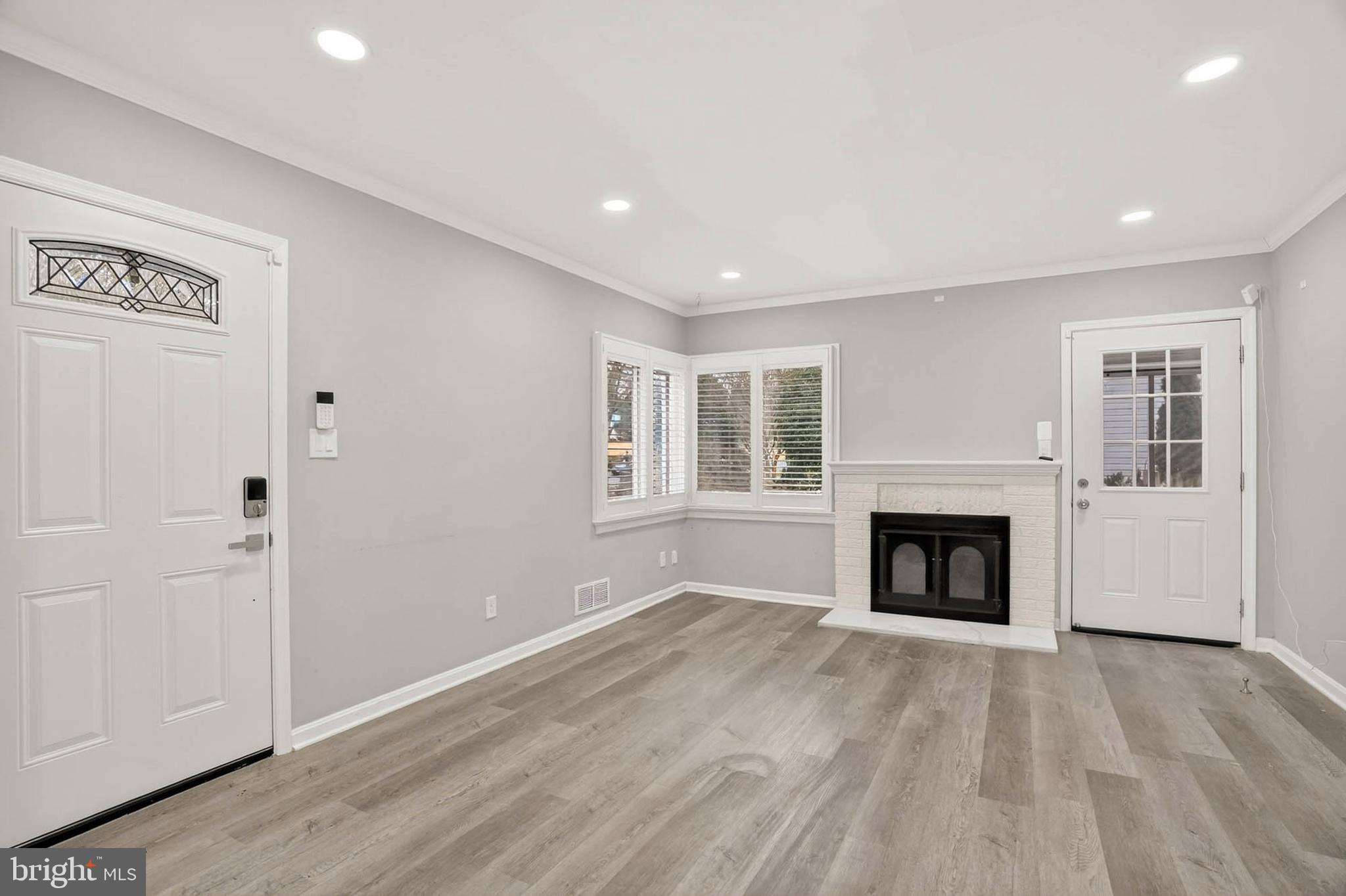 110 Melbourne Avenue Silver Spring, MD 20901 - Photo 2 of 33 Living room w/ fireplace & access to porch