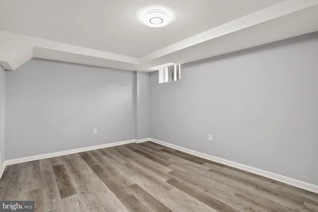 a view of room with wooden floor and window