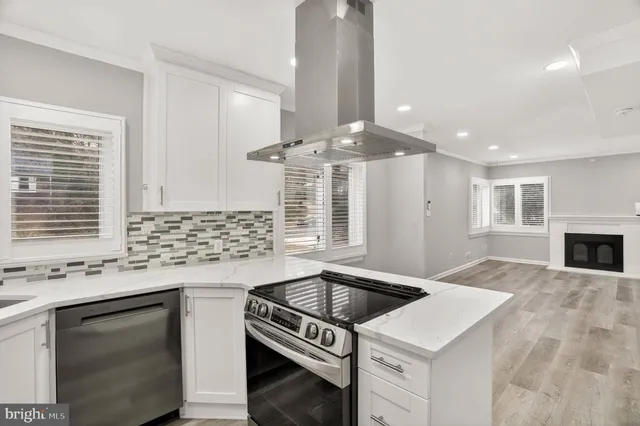a kitchen with a stove and a microwave